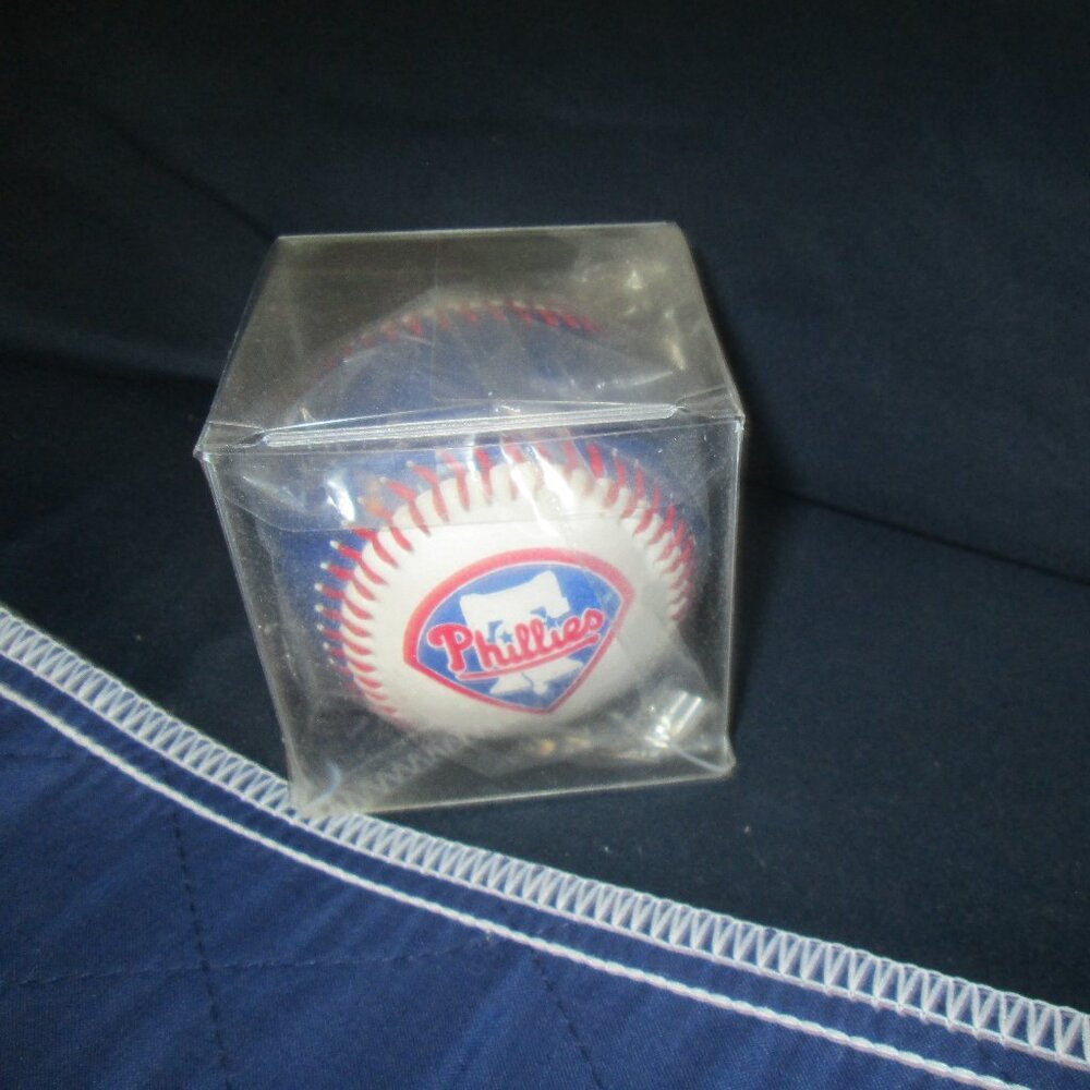 Baseball with a Phillies logo on it